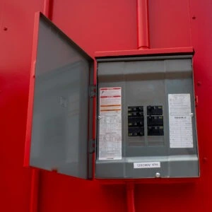 Electrical box mounted in a hazmat storage building